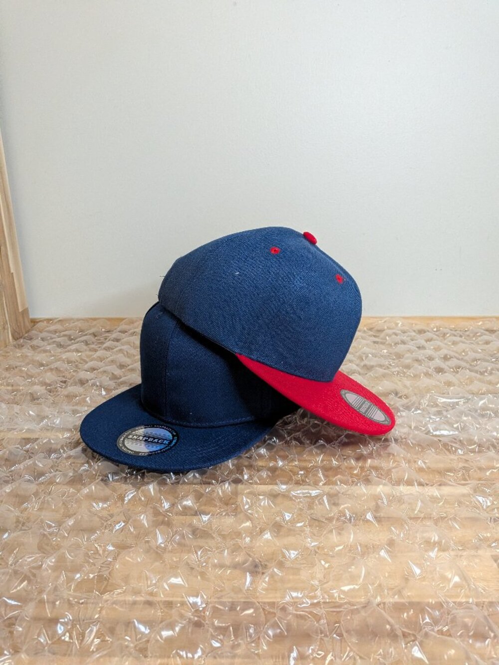 Blue and red baseball caps.